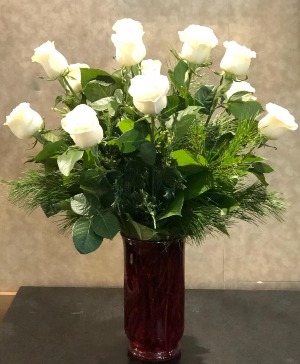 1 Dozen White Roses With Winter Greens Red Vase Arrangement