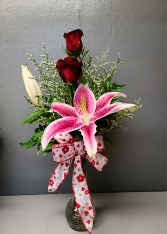 2 red roses and a star fighter lily Fresh Flower Arrangement 