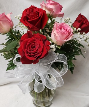 3 Red and 3 Pink Roses arranged in a vase with Filler and Bow!