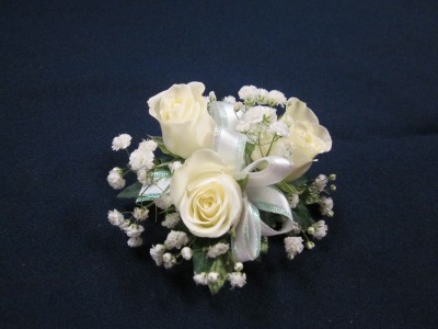 3 Rose Corsage, $25.00  Available in white, red, pink, yellow and orange
