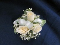 3 Rose Corsage Round Style  $25.00 Pink, Yellow, Hot Pink, Orange and Red also available