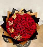 RED ROSES WRAPPED WITH GOLD BUTTERFLIES 