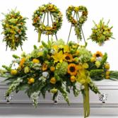 5 PC SUNFLOWER PACKAGE/WAS $1,500.00/NOW $850.00  STANDING SPRAY, WREATH,OPEN HEART PEDESTAL, AND CASKET. IN STORE CASH PURCHASE $800
