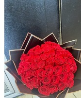 50 RED ROSES WRAPPED BLACK PAPER  