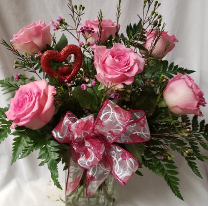 6 pink roses arranged in a vase with a heart pic And Valentine's bow!