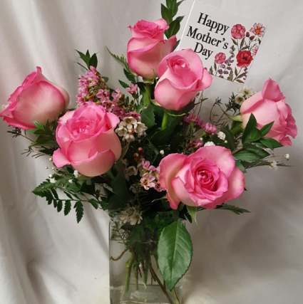 6 Pink Roses arranged in vase with Seasonal filler And wooden Mother's Day Pic.