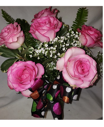 6 pink roses arranged in vase with a Halloween Bow 