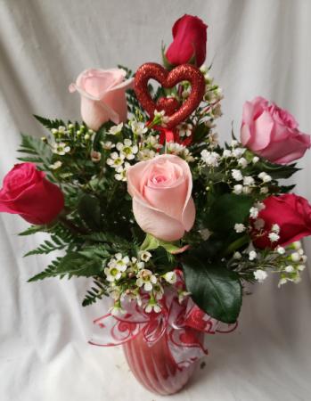 6 pink roses...different shades of pink arranged  Or all same color of pink if not in stock In a vase with heart pic, filler wax or baby's breath whatever is available and bow.