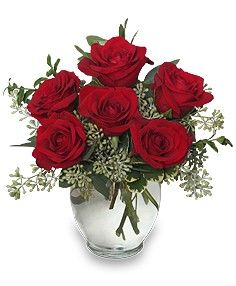 6 red roses in ginger vase