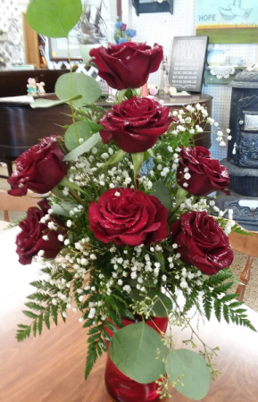 7 roses in a vase 