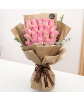 A delightful  pink roses wrapping Bouquet