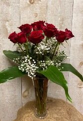 A Dozen Red Roses with the "fixin's" in a clear glass fluted vase