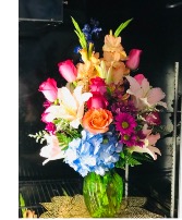 A Glorious Array Mixed floral bouquet in a vase