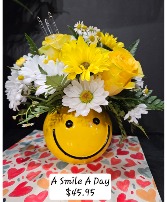 A Smile A Day Smiley face container fresh floral arrangement