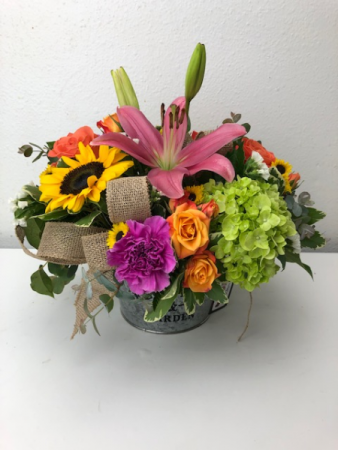 A Tin of Spring Container Arrangement