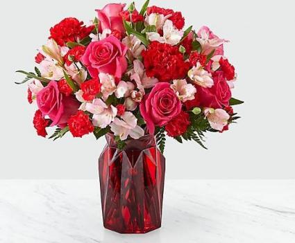 Adore You ™ Bouquet Fall in love at first sight with our Adore You™ Bouquet. Beautifully designed with hot pink roses, red carnations and pink alstroemeria.