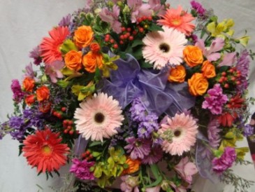 BRIGHT MEMORIES Half Casket Spray of Lavenders, oranges, pinks and lime greens. Spray roses, gerbera daisies, carnations, button poms and berries