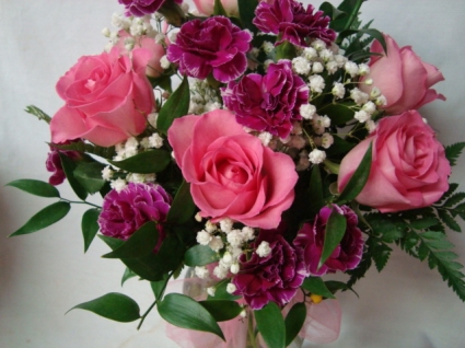 So Cute!! 6 Pink Roses with mini carnations arranged in a vase with baby's breath.