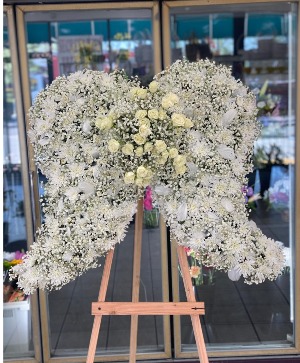 All White Angel Wings On A Easel 