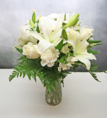 ALL WHITE FLORAL IN CLEAR VASE PURE WHITE FLOWERS