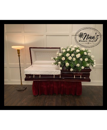 All white rose casket spray   in Bryan, TX | NAN'S BLOSSOM SHOP