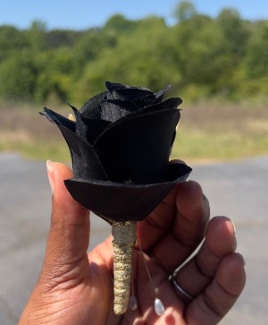 Allergy friendly black and gold bouttoniere  