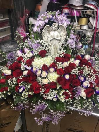 Angel casket cover  .  in Ozone Park, NY | Heavenly Florist