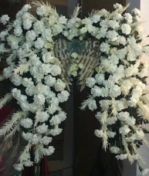 ANGELS WINGS Glorious mix of white carnations, roses and feathers 