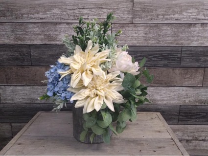 Artificial blue, cream and pale p metal container Silk arrangement