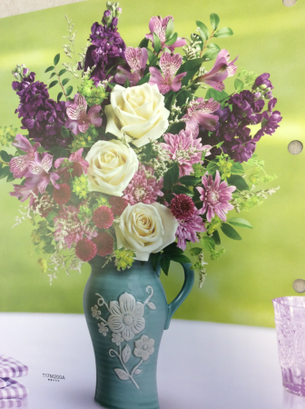 Artisanal beauty Arrangement in blue ceramic water jug