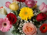 ! Dozen mixed roses and Gerbera Daisies (E) arranged in a vase with baby's breath!!