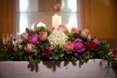Sweetheart table with peonies and esperanza roses Reception