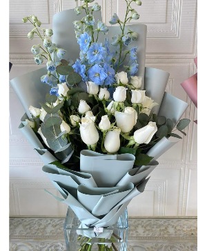 baby blue and white wrapped bouquet 