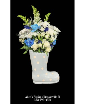 Baby Boy Bootie Fresh cut flowers in a ceramic container