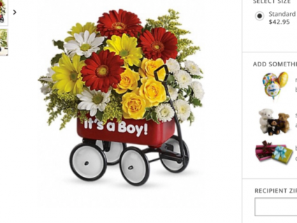 Baby wagon Fresh flowers arranged beautifully in a little red wagon