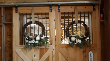 barn door wreaths reception