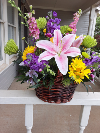 basket of mix flowers dark wood basket mix with fall colors