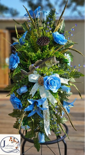 Bass and the color Blue  Silk spray on easel with bass and variety of blue themed flowers 