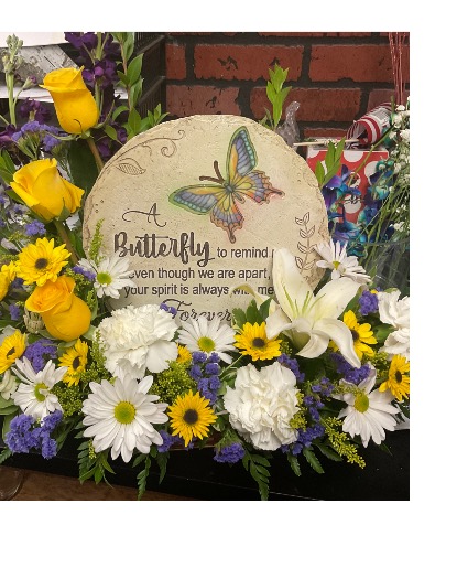 Beautiful Butterfly  Outside stepping stone surrounded with flowers 