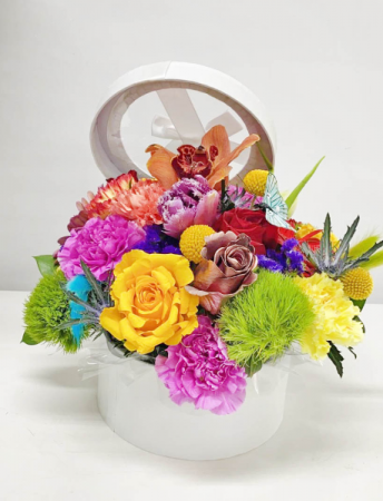 SPRING SURPRISE Flowers in Tall Circular Container