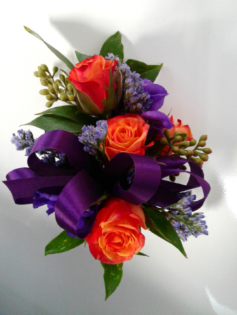 purple corsage and boutonniere for prom