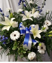BLUE AND WHITE SEASONAL FLOWERS WITH BLUE AND  White Bow.