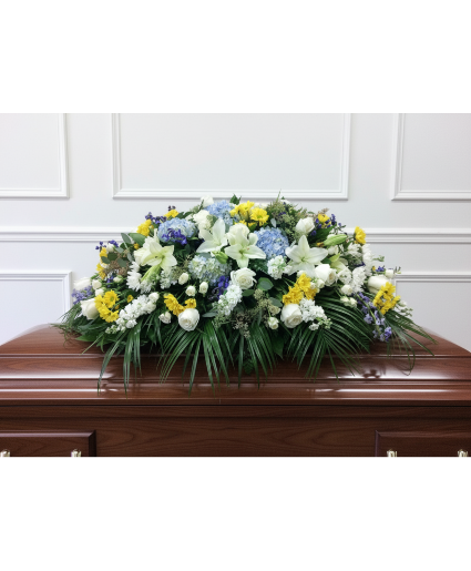 Blue and white with a touch of yellow casket spray 