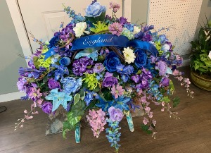 Blue hue’s casket spray  Silk casket arrangement