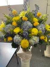 Blue Hydrangeas and yellows together  Funeral or cremation 