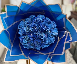 Bejeweled Blue roses wrapped in blue paper