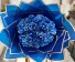 Bejeweled Blue roses wrapped in blue paper 