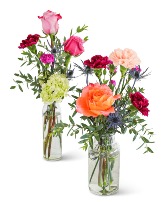 Bottles of Prismatic Buds Flower Arrangement