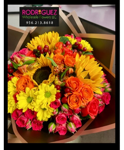 Bouquet Includes a variety of flowers; roses, sunflowers, and more