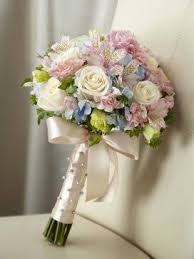 Bouquet with just a touch of soft blue For both a Bride and can be made smaller for your girls..prices vary due to size.